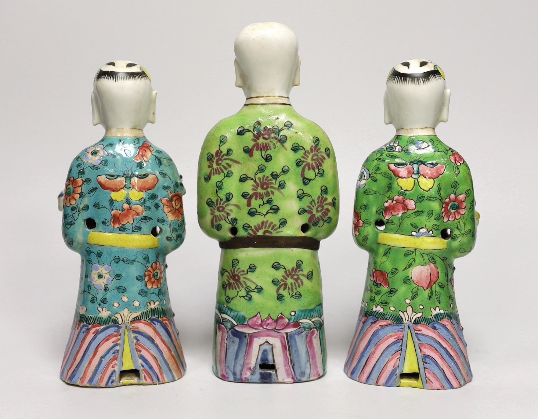 A near pair of Chinese polychrome-decorated figural incense burners and another similar incense burner, Jiaqing period (1796-1820), tallest 20.5cm